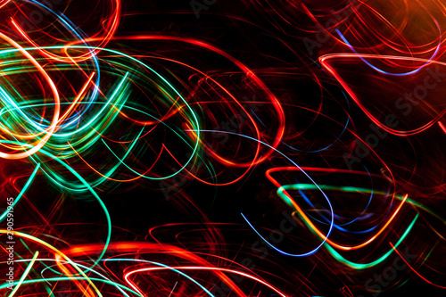 Abstract colored glowing bokeh lines.