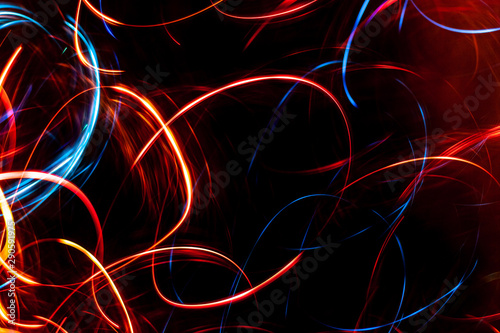 Abstract colored glowing bokeh lines.