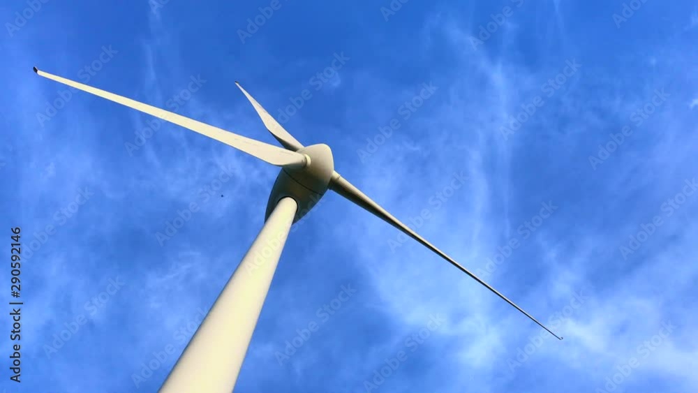 Clean energy: wind turbine against blue sky Clean energy: wind turbine against blue sky