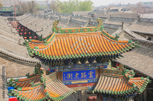 A colored tiled roof of a city gate in Pingyao seen from the city wall