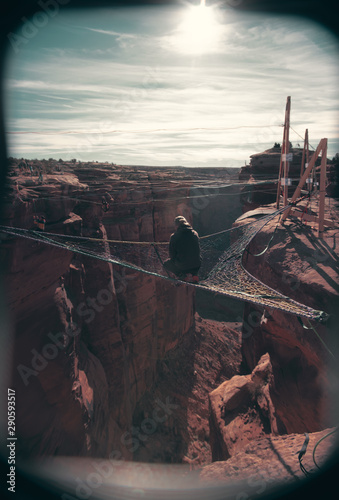 Person sitting on mountain hammock during day