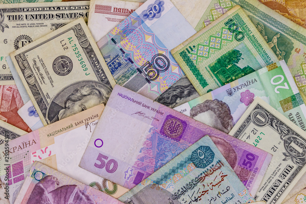 Obraz premium Multicurrency background of US dollars, Russian rubles, Belarusian rubles, Egyptian pounds and Ukrainian hryvnias
