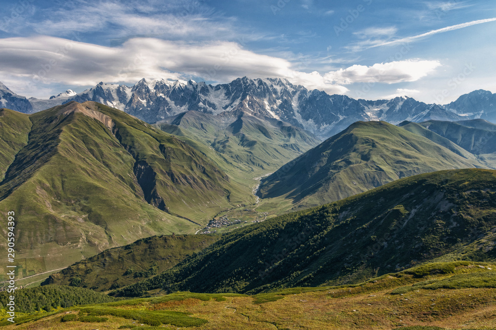 Obraz premium view of main Caucasian ridge from Svanet ridge, panorama of Caucasus, view of mountains and mountain valley, village in mountains, Ushguli, Caucasus, Georgia