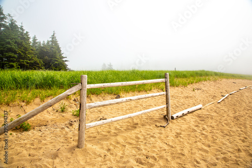 Partial fence along the edge of the beach at Sand Beach in Acadia National Park