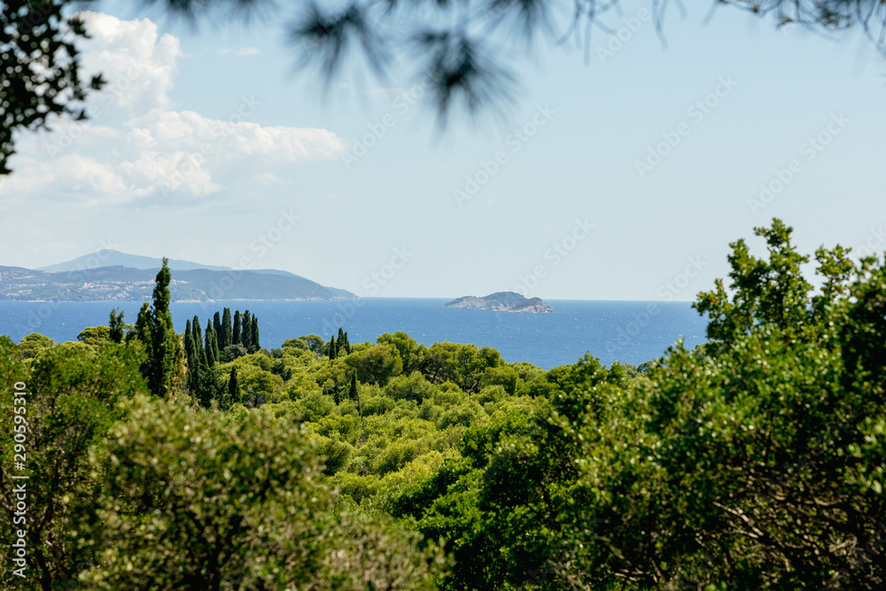 Views of the Adriatic Sea - clear blue water, boat, rocky shore. Sea cruise in a paradise