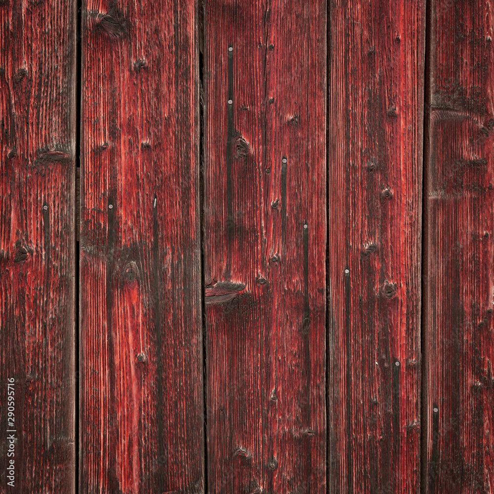 The old red wood texture with natural patterns The old red wood texture with natural patterns