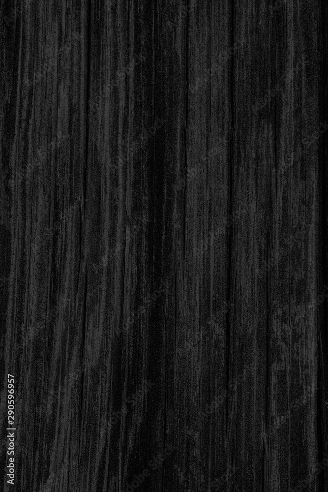 Naklejka premium Black wooden background, wood texture, vintage timber plank wall close up. Vertical orientation.