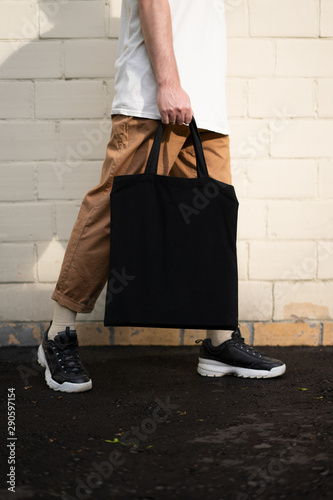 Man holding cotton Black Tote bag