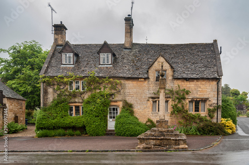 STANTON, ENGLAND - MAY, 26 2018: Stanton is a village in the Cotswolds district of Gloucestershire and is built almost completely of Cotswold stone, a honey-coloured Jurassic limestone   photo