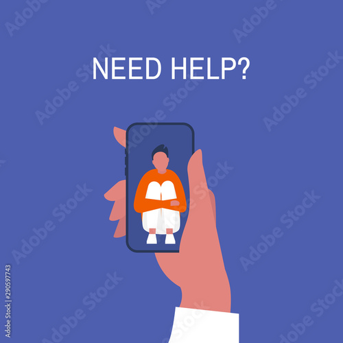 Crisis hotline. Need help? Hand holding a smartphone. New technologies. Therapy. Appointment. Mental health. Millennials. Young lonely male character hugging his knees.
