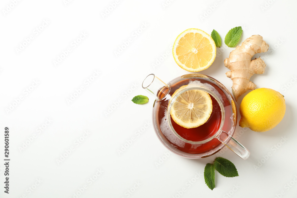 Flat lay. Teapot, lemon, mint and ginger, space for text Flat lay. Teapot, lemon, mint and ginger, space for text