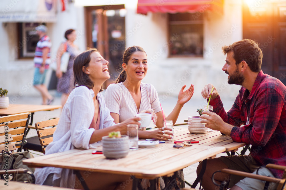 Group of friends enjoyed talking and drinking coffee together