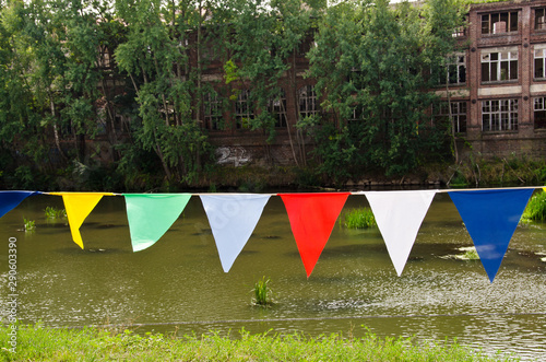 A bunting of colorful burgees flittering in the wind photo