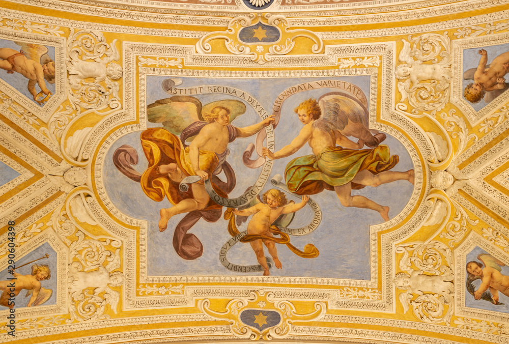 OSSUCCIO, ITALY - MAY 8, 2015: The baroque fresco of angels with the mariological inscriptions in church Sacro Monte della Beata Vergine del Soccorso by Salvatore Pozzi di Puria  (1595 – 1681).