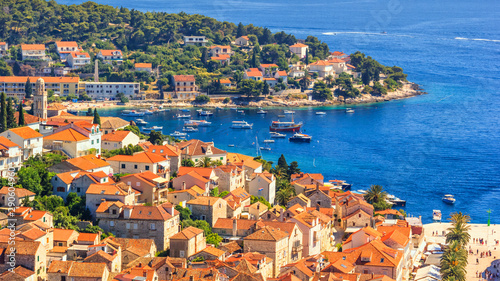 Fototapeta Naklejka Na Ścianę i Meble -  Coastal summer landscape - view of the City Harbour of the town of Hvar, on the island of Hvar, the Adriatic coast of Croatia