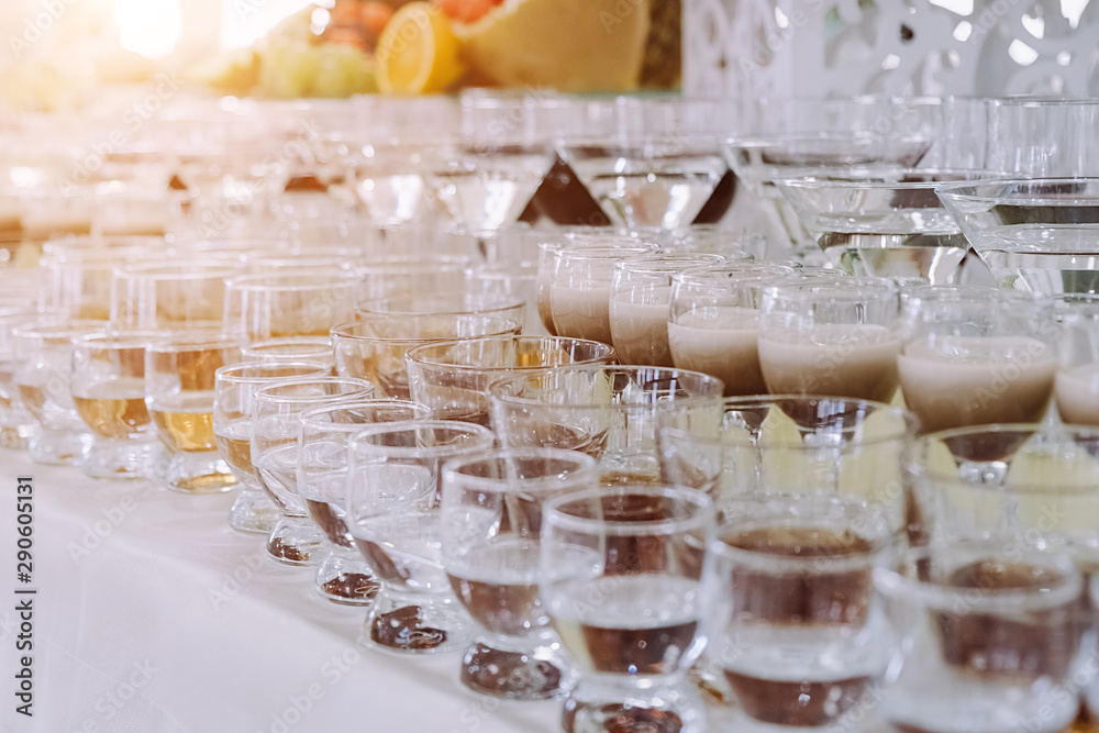 Festive table with cold exotic alcoholic beverages, cocktails. Party and holiday celebration concept