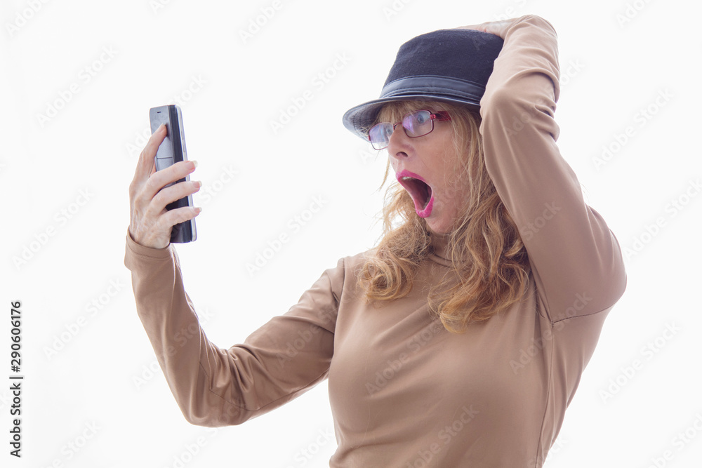 senior adult woman with mobile phone and surprise expression isolated on white background senior adult woman with mobile phone and surprise expression isolated on white background