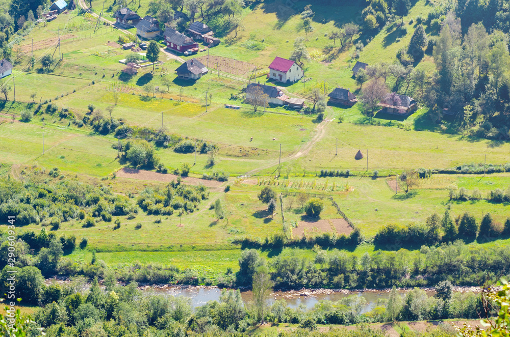 Ukraine Carpathians, a settlement in a valley of mountains, beautiful landscape aerial view