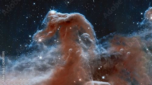 The Horsehead Nebula upper ridge illuminated by Sigma Orionis. Science astronomy concept wallpaper. Elements of this image were furnished by NASA  ESA