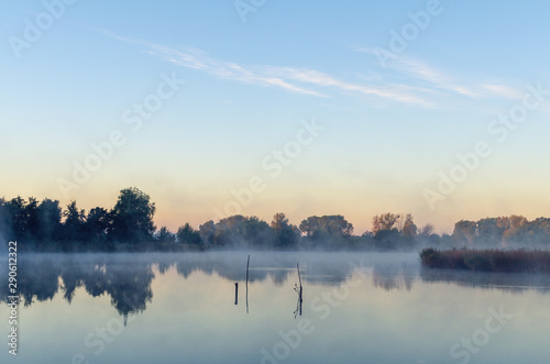 Fototapeta Naklejka Na Ścianę i Meble -  Morning landscape with fog over the lake