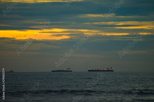 ships in the sea at sunset © Ravindra Joisa