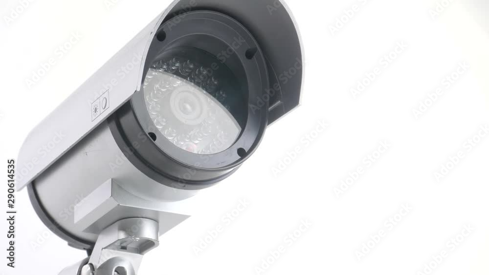 Security video camera moving to scan the area for surveillance purposes. Robotic CCTV recording technology. Security video camera moving to scan the area for surveillance purposes. Robotic CCTV recording technology.