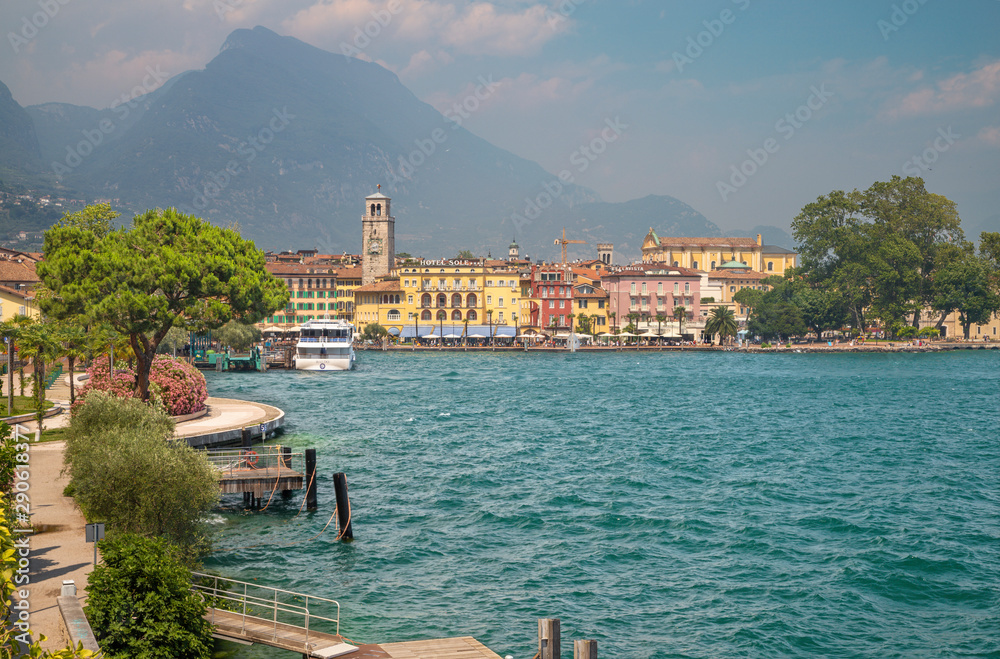 RIVA DEL GARDA, ITALY - JUNE 6, 2019: The City from south with the Alps in the backgound.