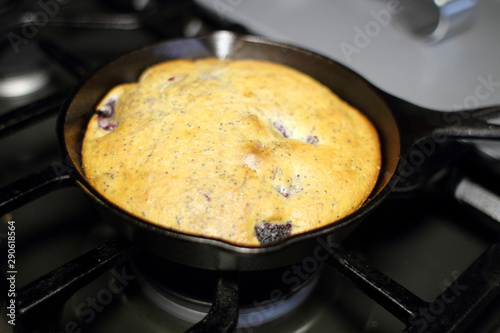 Blackberry and poppy seed cake fresh out of the oven, made in a cast iron 6 inch skillet.