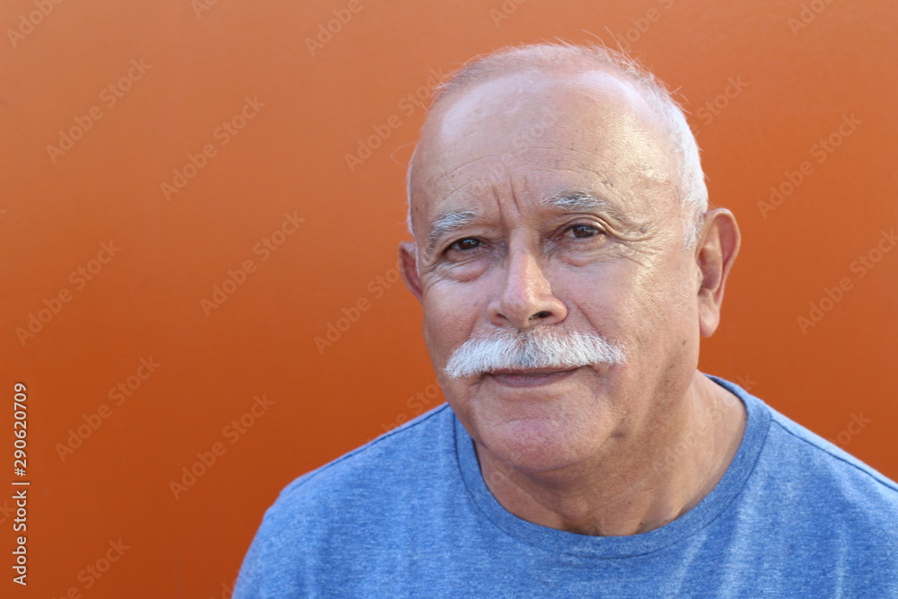 Senior Hispanic man in orange background Senior Hispanic man in orange background