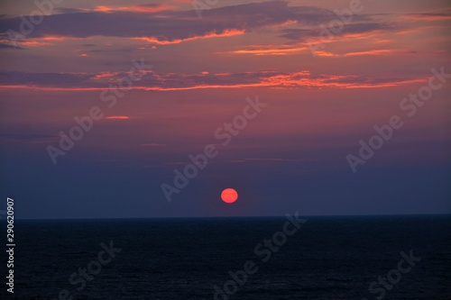 a sunrise on the beach in Mamaia