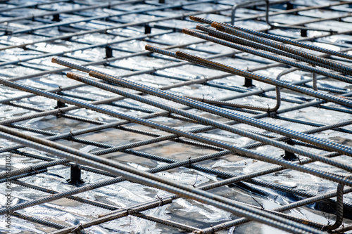 Fotografie Steel rebar and wire mesh with shallow depth of field