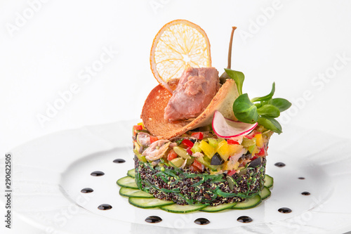 Salad of quinoa, seaweed, meat, vegetables and pumpkin seeds. Dietary, wholesome and tasty. Banquet festive dishes. Gourmet restaurant menu. White background.