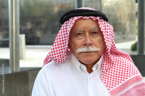 Arrogant looking Arabic man isolated photo