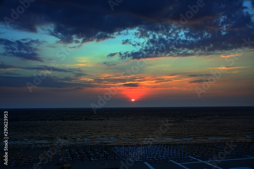 a sunrise on the beach in Mamaia