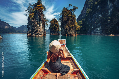 young woman tourist in asian hat on the boat at lake  © zolotareva_elina