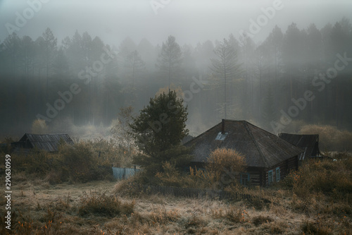 house in fog photo