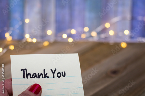 Thank You concept with words on handheld paper