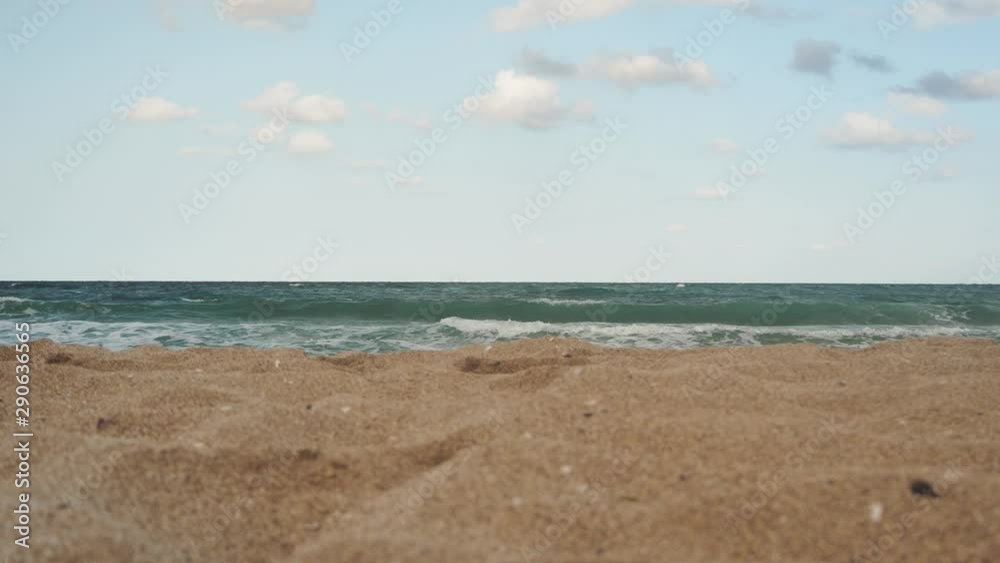 Beautiful seascape. Low angle shot from sand. Water splash. Beautiful seascape. Low angle shot from sand. Water splash.