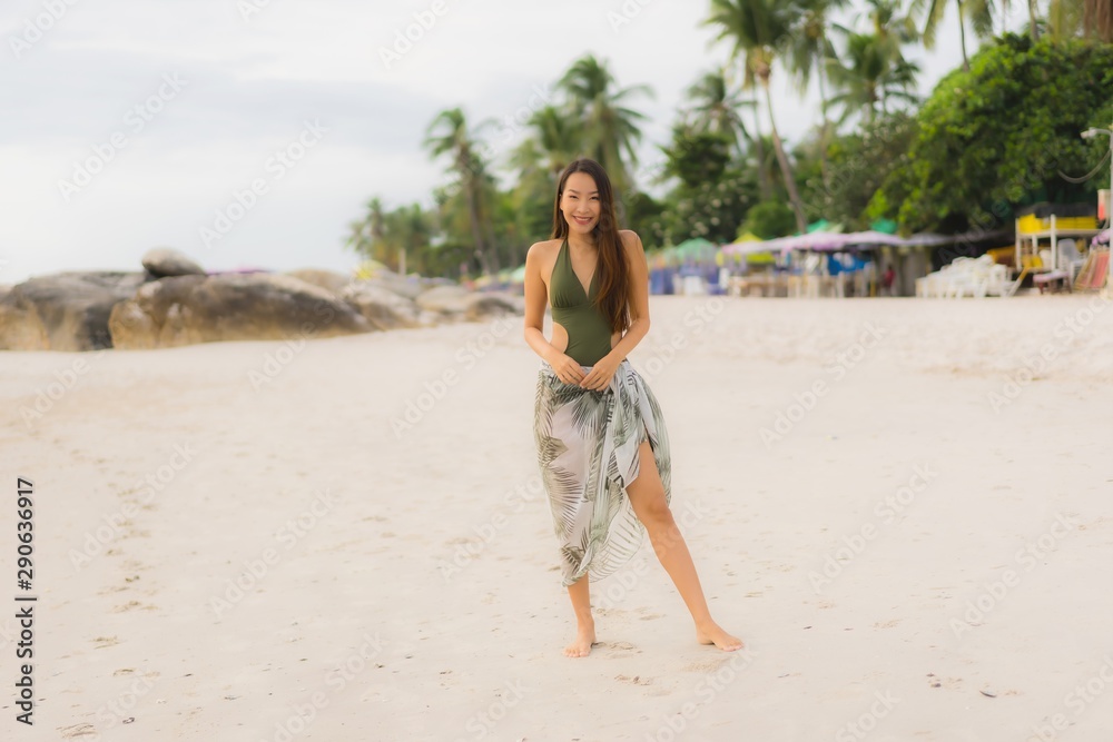 Portrait beautiful asian women happy smile relax on the tropical beach sea ocean Portrait beautiful asian women happy smile relax on the tropical beach sea ocean