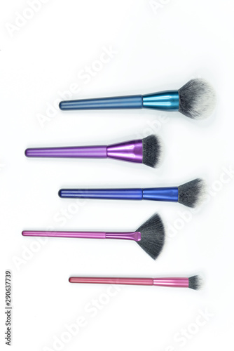 Set of colorful brushes for makeup isolated on white background.
