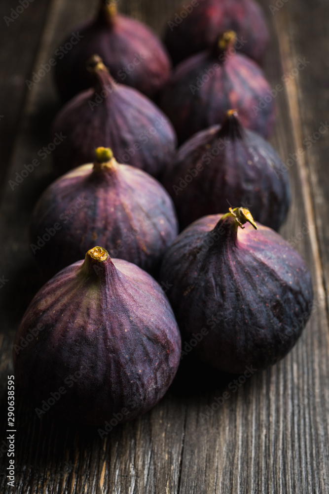 Fresh ripe figs on the rustic background. Selective focus. Shallow depth of field. Fresh ripe figs on the rustic background. Selective focus. Shallow depth of field.