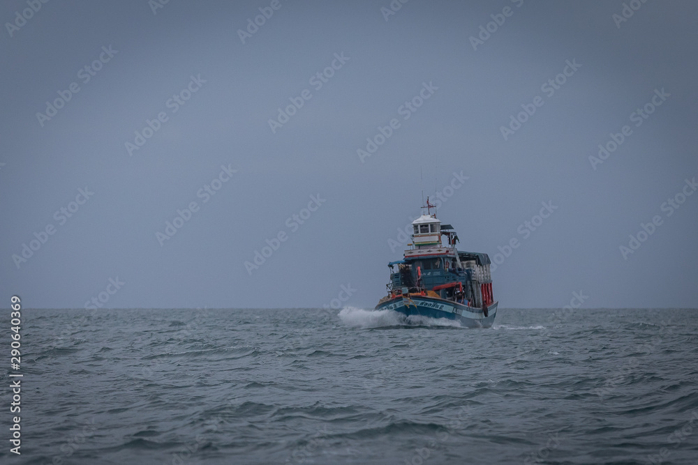 Fisherman boat in the storm sea, Thailand