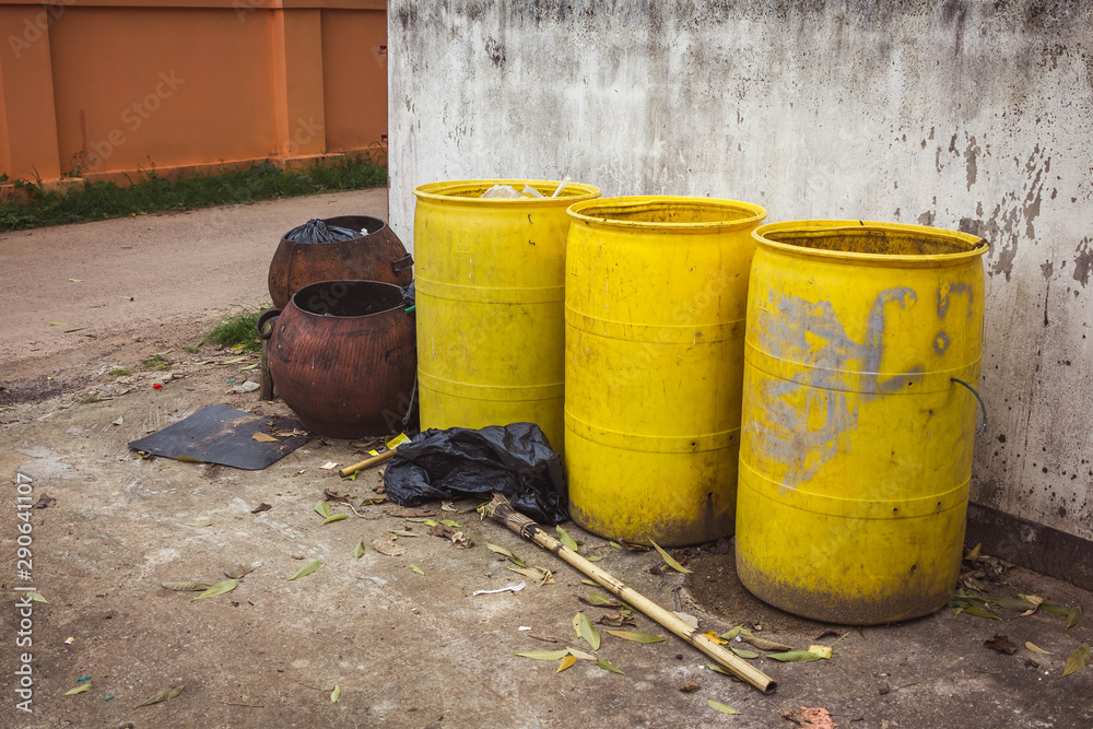 Old yellow trash empty on the wall Old yellow trash empty on the wall