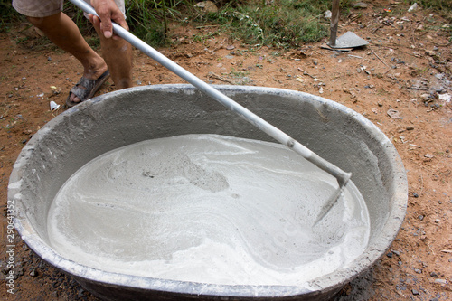 Mixing cement for construction © nopphakorn