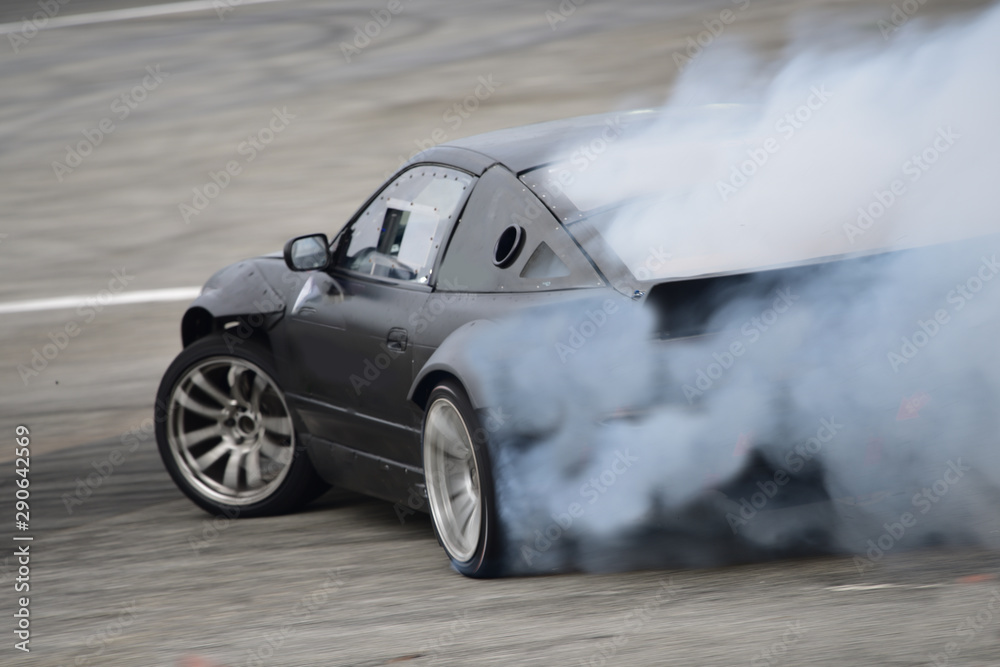 Motion Blur side view drift car . Drift car with smoke from burning