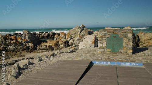 Landmark in L'Agulhas showing Africa's most southern point where the Indian- & Atlantic ocean meet, panning shot