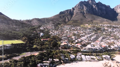 drone view camps bay cape town with table mountain in the back ground