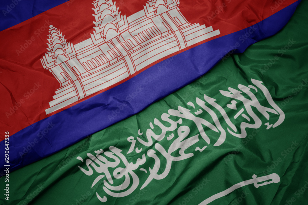 waving colorful flag of saudi arabia and national flag of cambodia.
