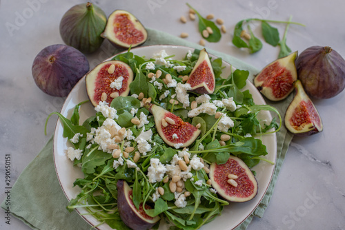Healthy Fig salad with feta cheese, nuts and aru