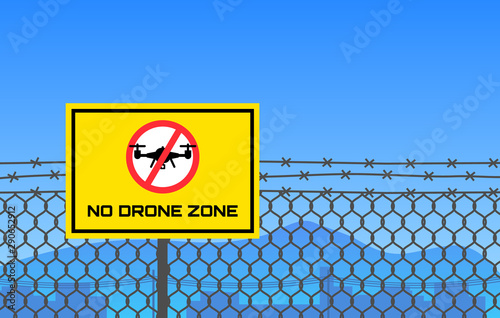 no drone zone sign hanging on barbed wire border restricted area
